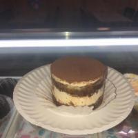 Tiramisu Round · Italian sponge caked soaked with espresso coffee, layered with sweet mascarpone cheese