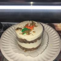 Carrot Cake Round · Sweet and lightly spiced carrot cake layered with a rich cream cheese frosting and decorated...