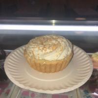 Banana Cream Tart · Flaky pie crust filled with banana pastry cream topped with real whipped cream and sprinkled...