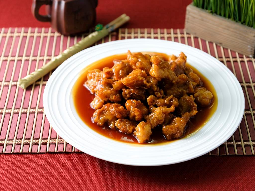 Orange Chicken · Chinese crispy chicken with homemade orange sauce and served with white rice.
