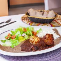 Doro Wot · Popular traditional food in both Ethiopia and Eritrea. Chicken stew cooked in a blend of spi...