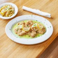 Chicken Francese · Chicken cutlet sauteed with butter, wine, and lemon.