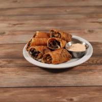 Southwest Chicken Egg Rolls · Smoked chicken, black beans, corn, pepper Jack cheese, red peppers, and spinach wrapped in a...