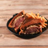 Reuben Sandwich · Grilled corned beef, sauerkraut, melted Swiss cheese and 1000 Island dressing on grilled mar...