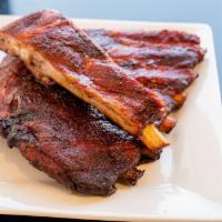 Smoked Pork Spare Ribs (À la Carte) · 2-3 Whole Spareribs  rubbed with our signature dry rub and smoked to be juice, sweet and sav...