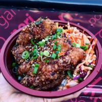 Garlic Fried Chicken · Chicken thighs tossed in our garlic shoyu sauce. Served with kimchi slaw and white rice.
