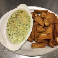 Spinach Artichoke Dip · A blend of Parmesan, mozzarella and cream cheese, served with fresh-made tortilla or pita ch...