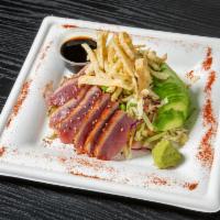 Seared Ahi Tuna Salad · Fresh greens, mixed Cabbage, avocado, carrots, red bell peppers, green onions, cilantro, roa...
