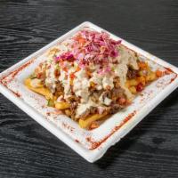 Shawarma in Pita  · OCK seasoned shawarma with hummus, tehina and Israeli salad inside. Choice of chicken or. tu...