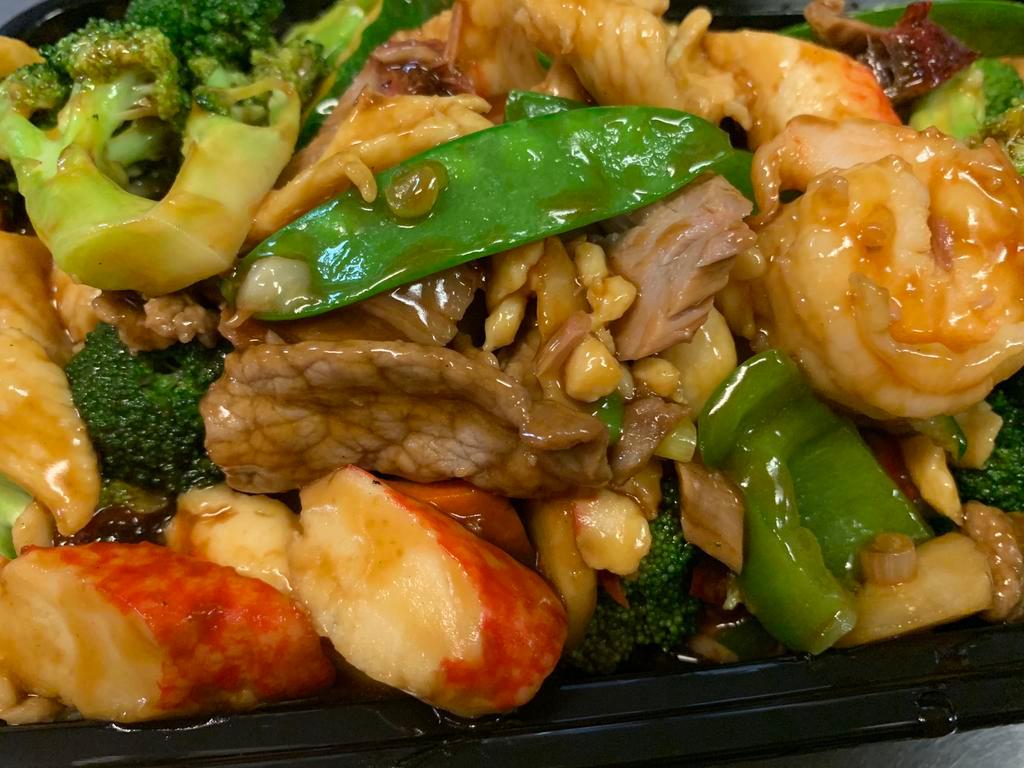 H1. Happy Family · Combination of beef, chicken, shrimp, barbecued pork, broccoli, carrots, snow peas, mushroom and baby corn.