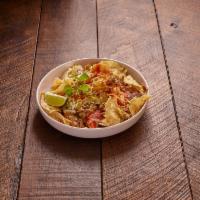 Nachos Fiesta · Layer of corn chips, covered with refried beans, gooey Monterey jack cheese, diced tomatoes,...
