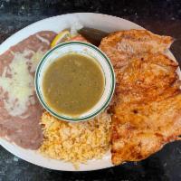 1. Chicken Breast a La Plancha · Marinated chicken breast grilled and served with green sauce and rice and beans on the side.
