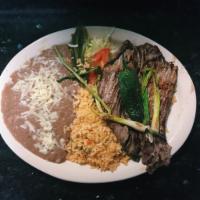 4. Carne Asada Dinner · A fillet of seasoned steak, grilled and served with green sauce on the side. Served with ric...