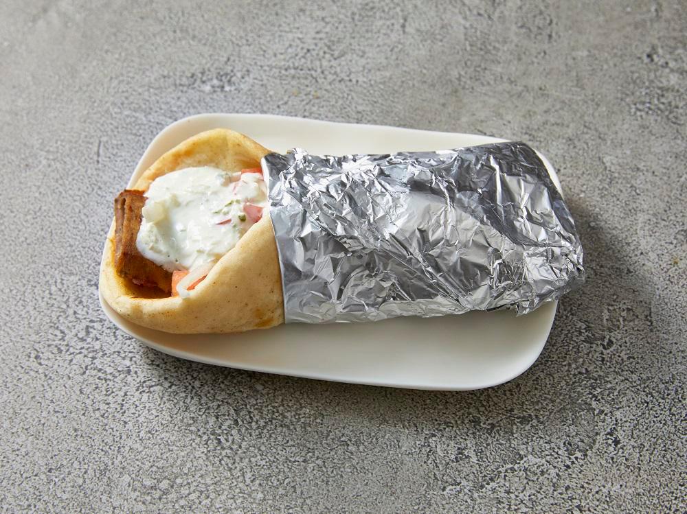 Chicken Gyro Pita · Marinated grilled chicken breast served on grilled pita bread with tomatoes, onions and house-made tzatziki sauce.