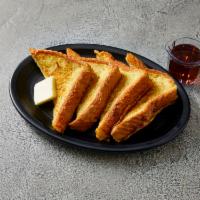 Traditional French Toast · Thick cut Texas toast hand dipped and grilled in our house-made sweet vanilla batter. Served...