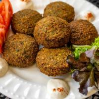 Falafel Side · Mashed chickpeas mixed with fine parsley, garlic, olive-oil with zesty Mediterranean spices ...