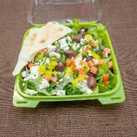 Greek Salad · Crispy romaine with tomato, onion, Kalamata olives, feta cheese, banana peppers tossed with ...