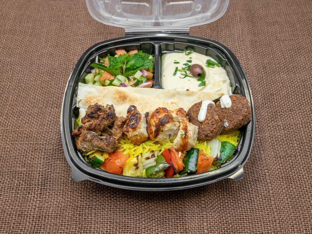 Combo Kabob Plate · A combination of our delicious chicken, beef, and crispy falafel. Served with Saffron Rice, Classic Hummus, Tabbouleh Salad  and pita bread. 