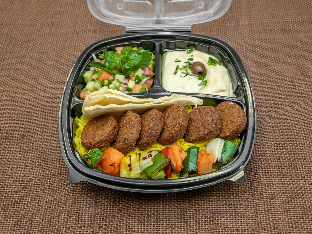 Falafel Plate · Mashed chickpeas mixed with fine parsley, garlic, olive-oil with zesty mediterranean spices and fried to perfect crunchiness. Served with Saffron Rice, Classic Hummus, Tabbouleh Salad  and pita bread. 