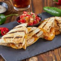 Chicken Quesadilla · Soft Wheat tortilla filled with chicken, Monterrey Jack cheese with a side of pico de gallo.