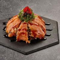 Crab Sushi Pizza · Crispy rice base, avocado, crab salad, smoked salmon, wakame, eel sauce, tobiko.
