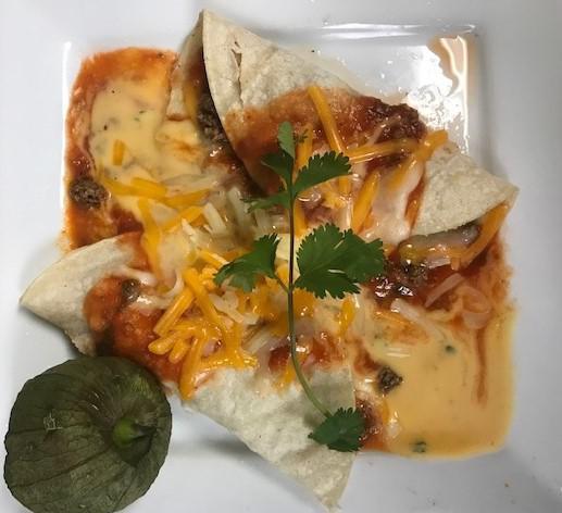 Enchilada Plate · Served with your choice of filling, tomato sauce, melted queso,
topped with sour cream, and guacamole. Served with rice, tortilla chips, salsa Fresca, and your choice of beans.
