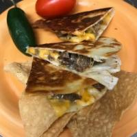 Quesadilla Plate · Golden brown grilled tortillas with queso medley, choice of filling,
Lettuce, tomatoes, and ...