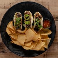 3 Piece Steak Tacos · Grilled rib eye, caramelized onions, zip sauce and cilantro.