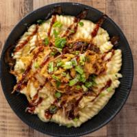 Pulled Pork Mac 'N' Cheese · BBQ pulled pork, fried onions and green onions.
