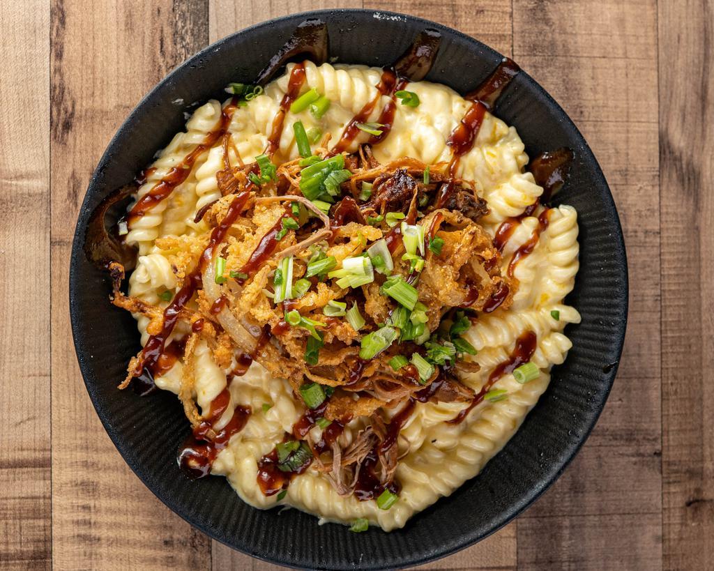 Pulled Pork Mac 'N' Cheese · BBQ pulled pork, fried onions and green onions.