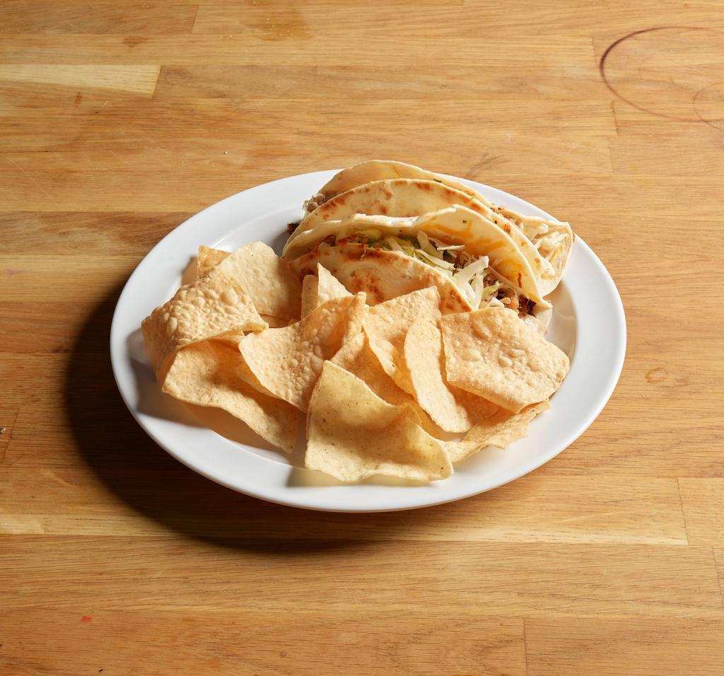 Poblano Chicken Tacos · Cabbage, cheddar Jack cheese, cilantro and cumin lime aioli served with fresh tortilla chips and salsa.