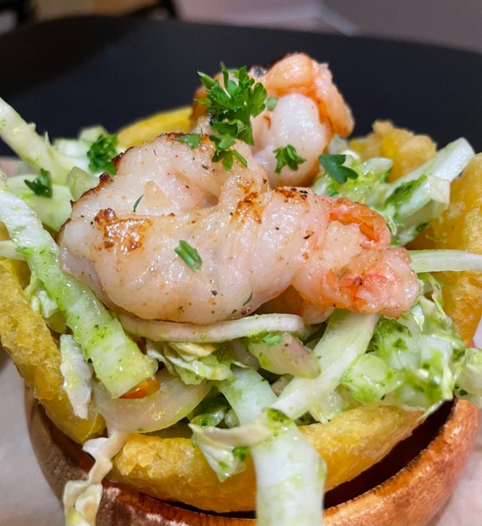 Martinez Cups · green plantain, napa slaw, grilled shrimp, grilled octopus, Canadian salmon, and avocado-pico sauce.