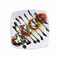 Caprese Salad · Fresh mozzarella cheese, sliced Roma tomatoes, extra virgin olive oil and basil, drizzled wi...