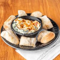 Roasted Artichoke & Spinach Dip · Our take on the classic, served with wood fried pizza crust.