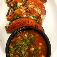 Quesa Birria Tacos · 3 Birria tacos stuffed with mozzarella cheese steamed flavored shredded beef, onions and cil...