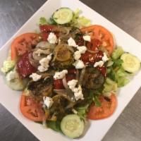 Grilled Vegetable Salad · Includes red pepper, green pepper, broccoli, zucchini, and squash topped with goat cheese.