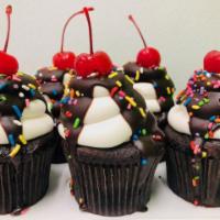 Chocolate Sundae · Dark chocolate cake, iced with buttercream and topped with chocolate, cherry and sprinkles