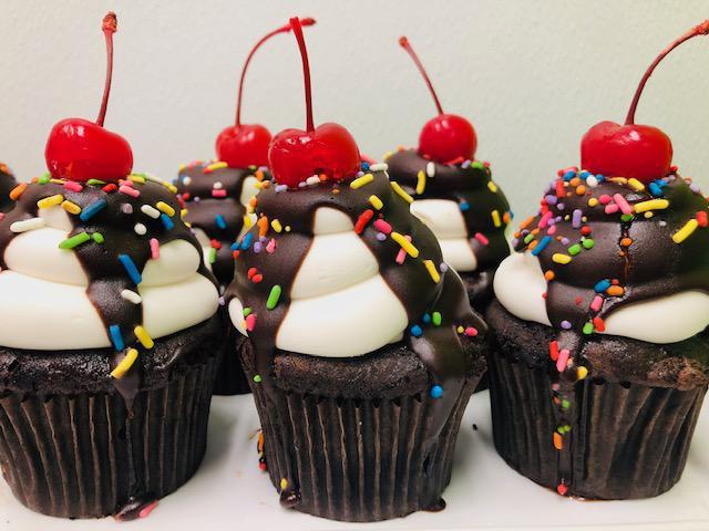Chocolate Sundae · Dark chocolate cake, iced with buttercream and topped with chocolate, cherry and sprinkles