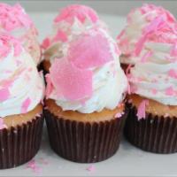 Pink Champagne · Pink Champagne cake filled with Bavarian cream.  Iced with whipped cream, covered in pink ch...