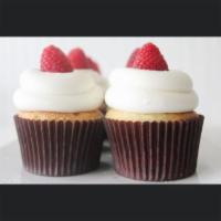Vanilla Bean Raspberry · Vanilla bean cake, filled with gourmet, seedless raspberry and iced in buttercream and a fre...