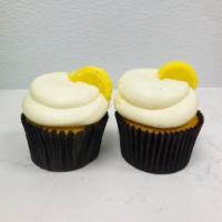 Lemon Drop · Lemon cake filled with a lemon ice.  Iced with buttercream and a lemon candy.