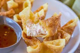 Crab Rangoon · 6 Crab meat with cream cheese wrapped in crispy wonton skins. 
Served with sweet and sour sa...