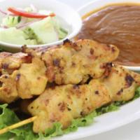 Satay chicken · Slice of grilled tender chicken on a stick, marinate with Thai herbs. Served with peanut sau...