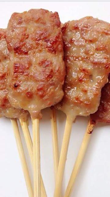 Moo Ping · Skewers of pork marinated in Thai cilantro, garlic sauce. Served with special sauce.