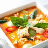  Red Curry · Red curry paste with sweet peas, carrot, bamboo shoots, bell peppers, and sweet basil leaves...