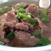 Beef Noodle Soup · Noodles in beef broth with slice beef, bean sprouts, top with green onions and cilantro.