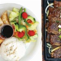 Short Beef Ribs  · Served with kimchi and pot sticker with side Korean fried dishes and white rice.