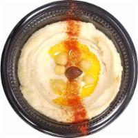 Hummus · Mashed chickpeas mixed with olive oil, lemon juice, tahini and garlic.