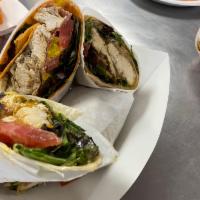 Asian chicken wrap  ·  chicken breast grilled then caramelized onions and grilled snow peas and red peppers Lettuc...