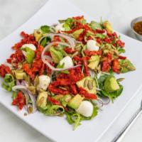 Om'echaye Salad · Avocado, dried tomato, arugula, spinach, onions, celery, mozzarella cheese and pumpkin seeds.